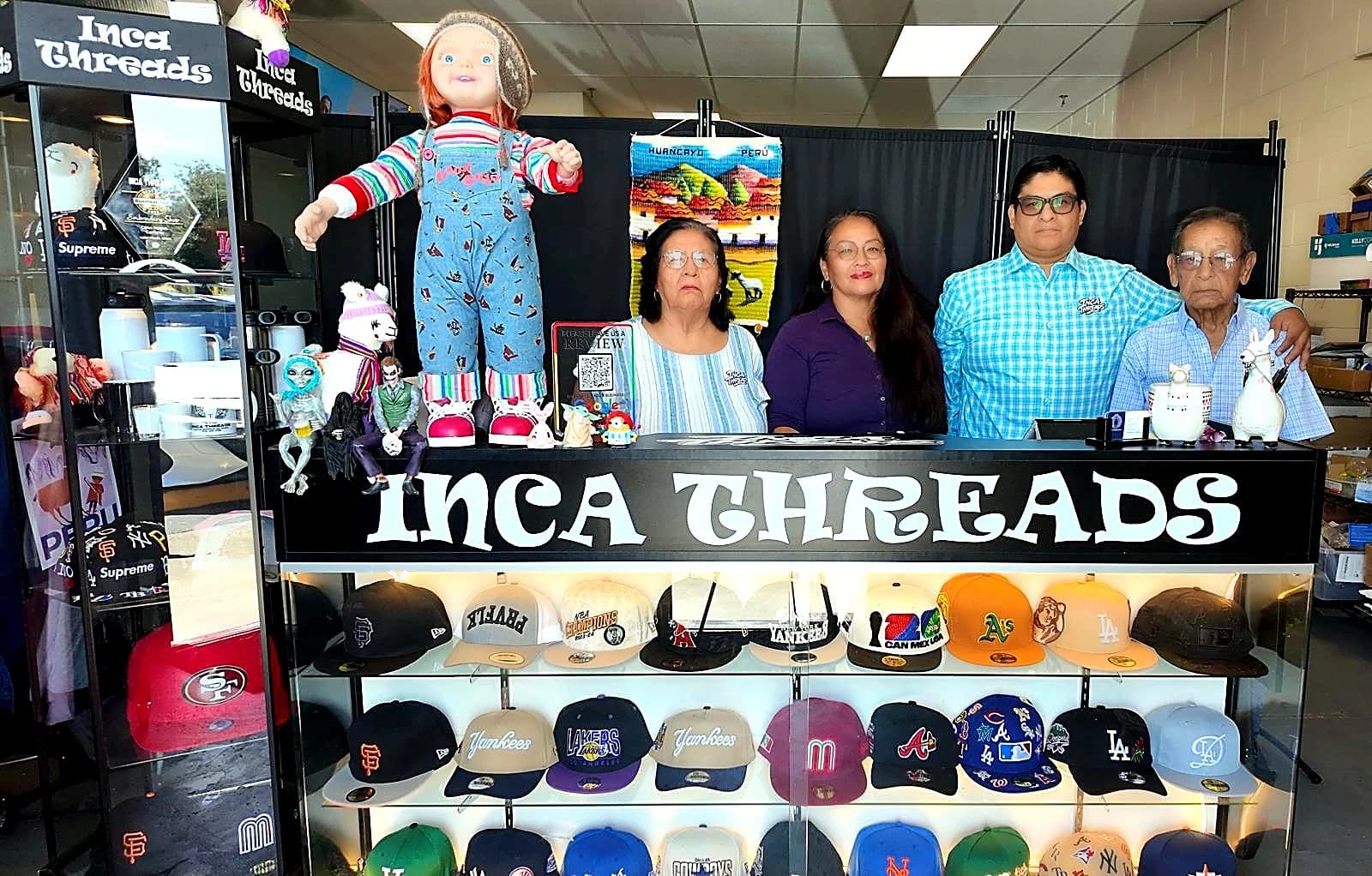 The Inca Threads family team standing behind their custom hat display at their Citrus Heights, California shop.