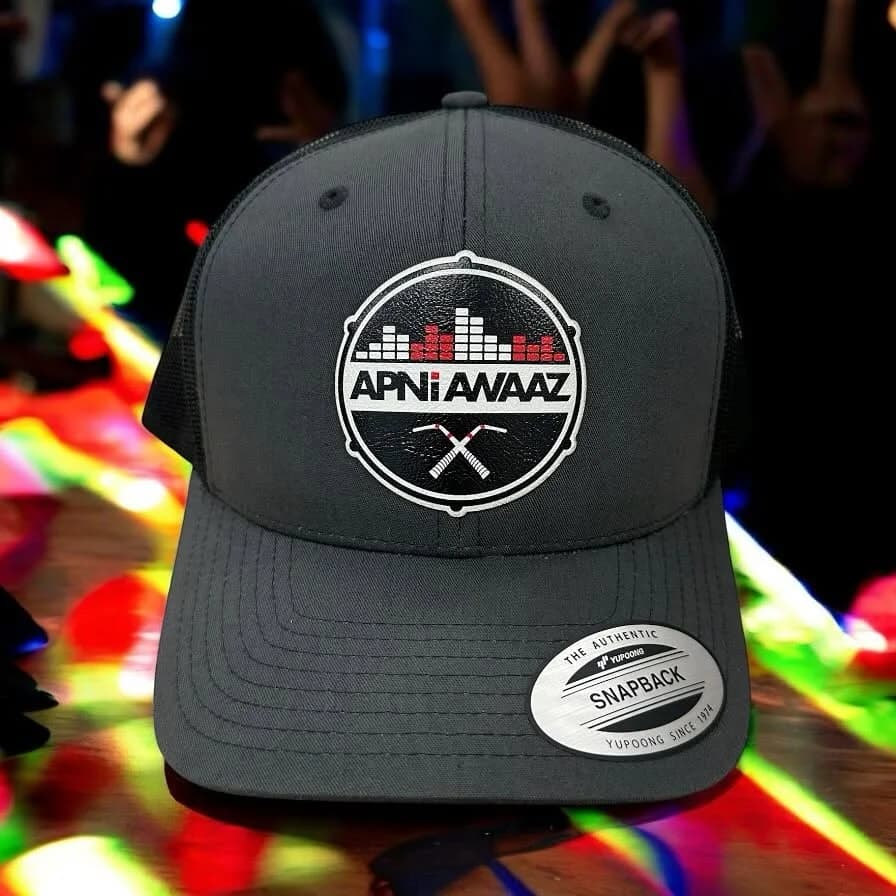 Finished bulk order of custom embroidered caps ready for pickup at Inca Threads in Sacramento, California.