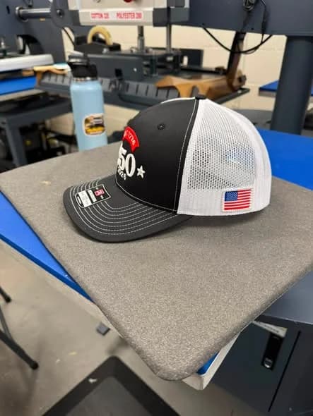 Side view of an embroidered commemorative cap made by Inca Threads for a Sacramento community celebration.