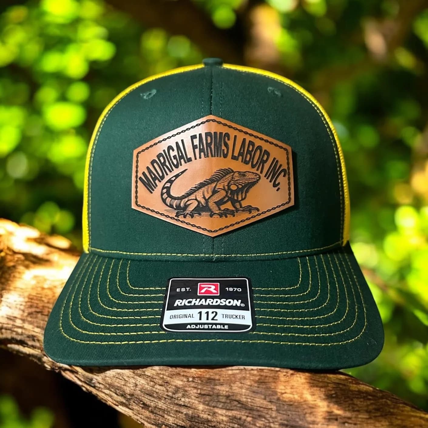 Leatherette patch hat with custom embroidered business logo, made by Inca Threads in Sacramento, California.