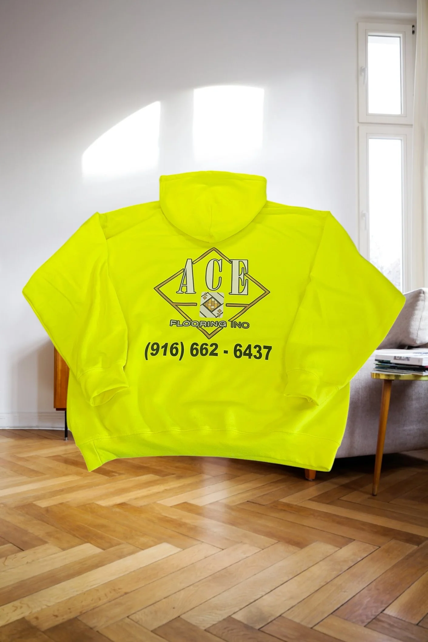 Custom printed hoodie with full-color logo, made by Inca Threads for a Sacramento flooring company.
