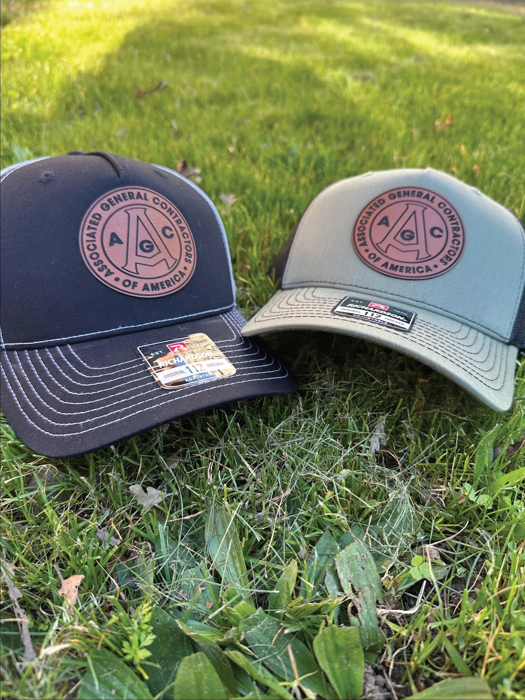 AGC leather patch caps with custom embroidered logo, produced by Inca Threads in Sacramento, California.