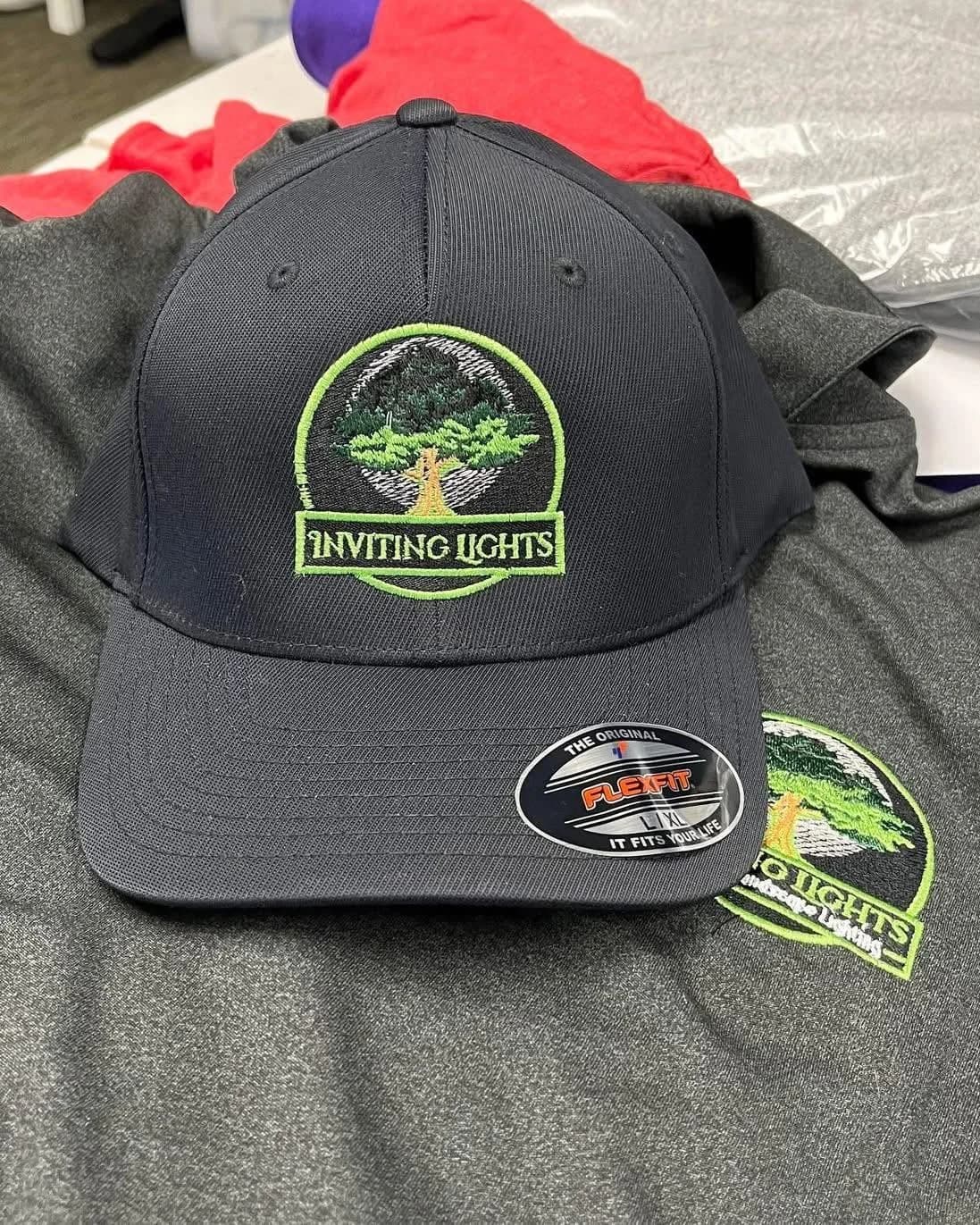 Inviting Lights embroidered cap with custom logo design, stitched by Inca Threads in Sacramento, California.