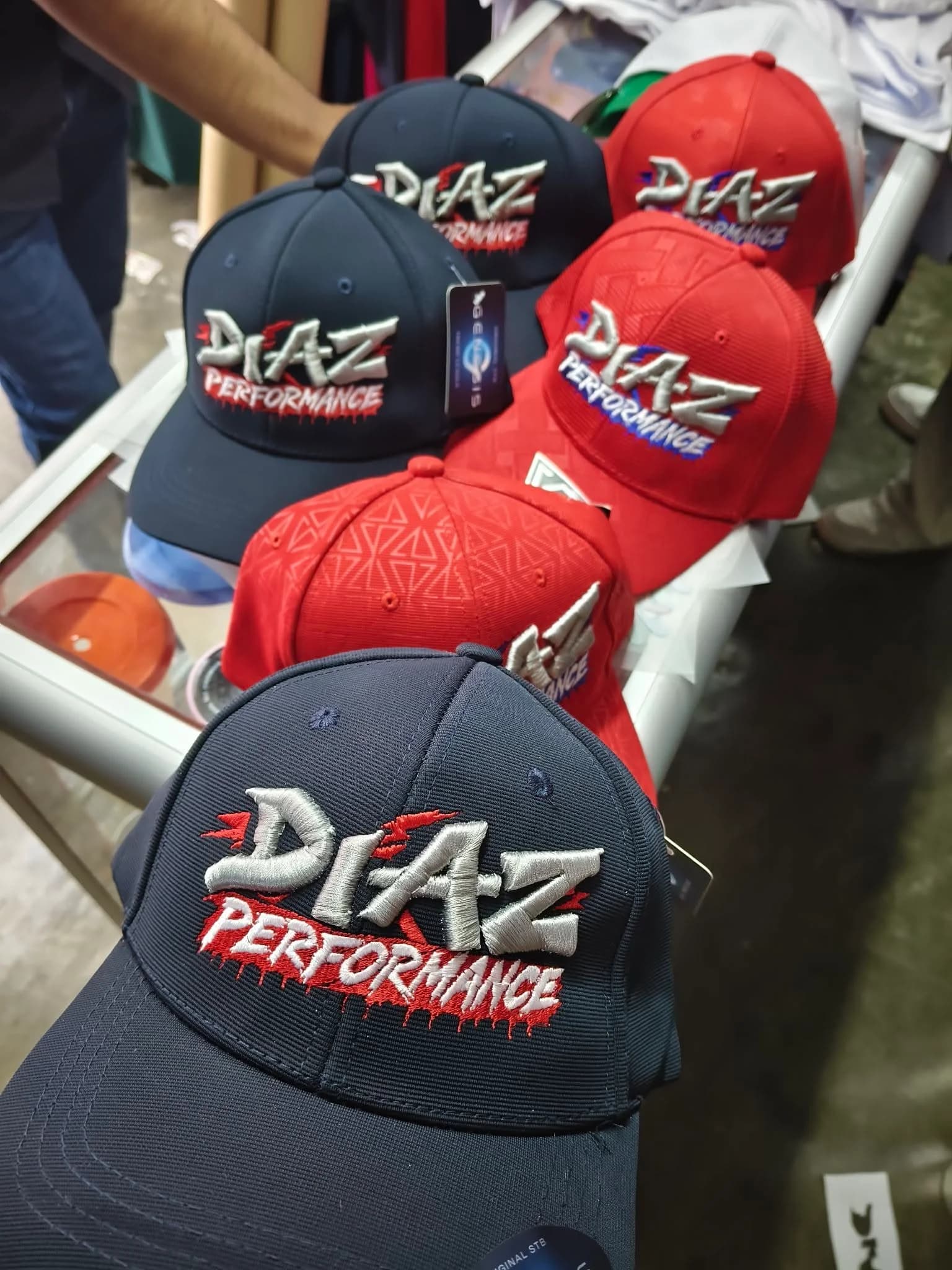 Embroidered cap lineup for a performance auto brand, custom stitched by Inca Threads in Sacramento, California.