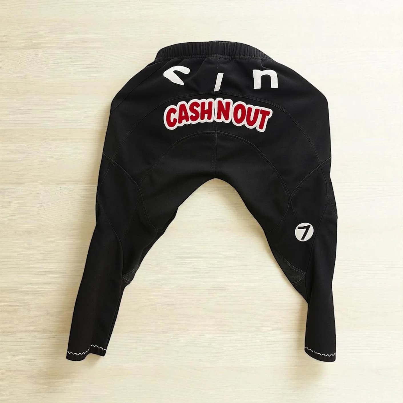 Racing pants with custom lettering and patch embroidery, decorated by Inca Threads near Sacramento, California.