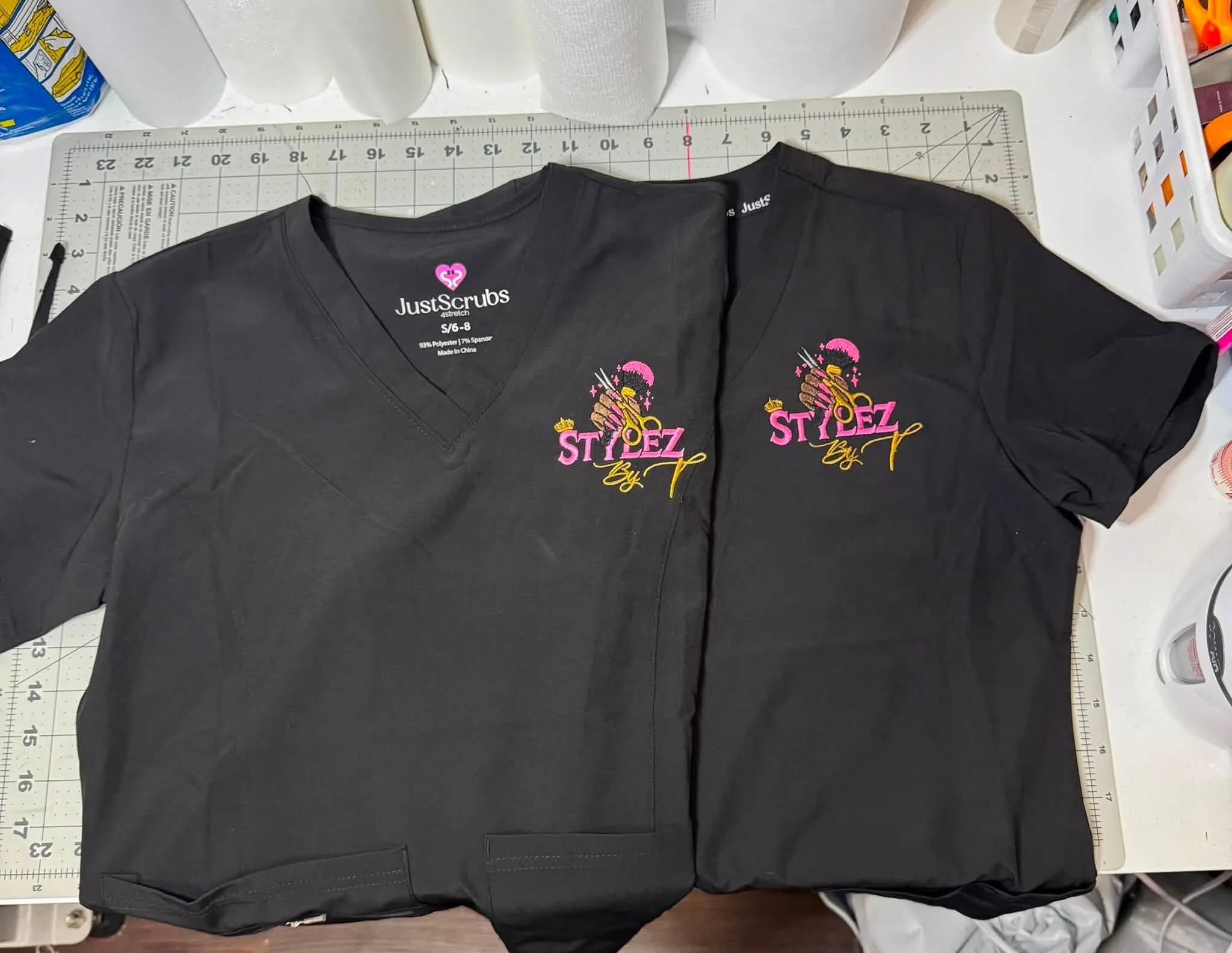 Embroidered salon scrubs with custom logo, created by Inca Threads for a Sacramento hair and nail salon.