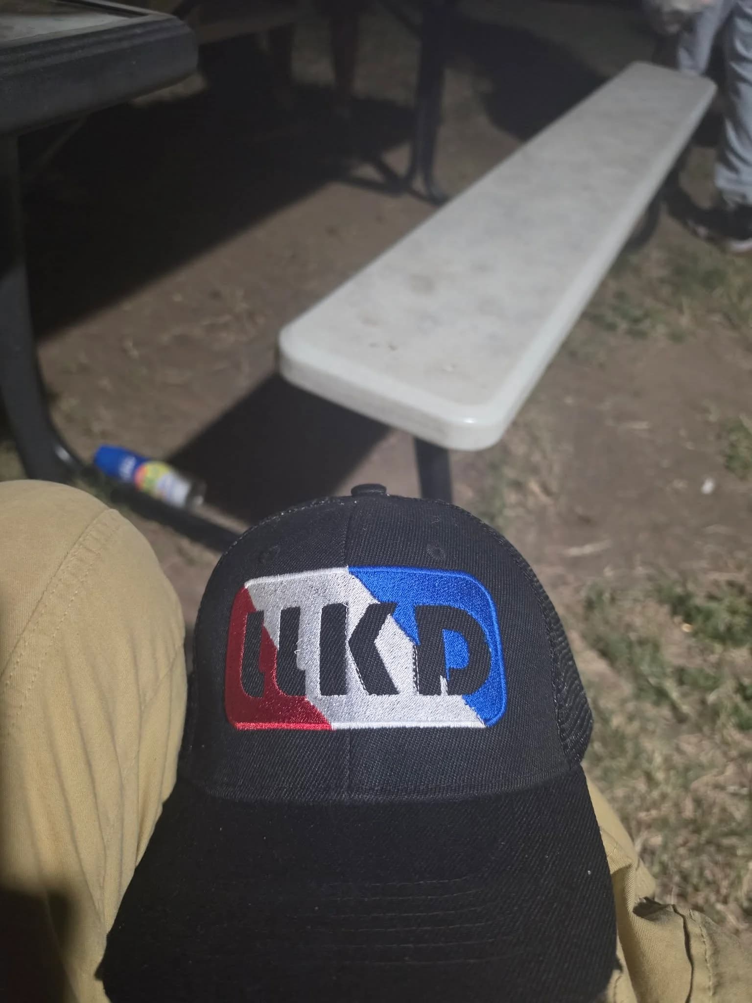 Custom embroidered trucker hat with brand logo, stitched by Inca Threads for a Sacramento-area business.
