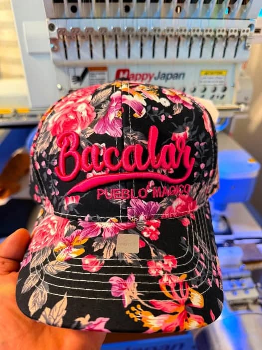 3D puff embroidery cap in production, stitched by Inca Threads for a Sacramento-area apparel brand.